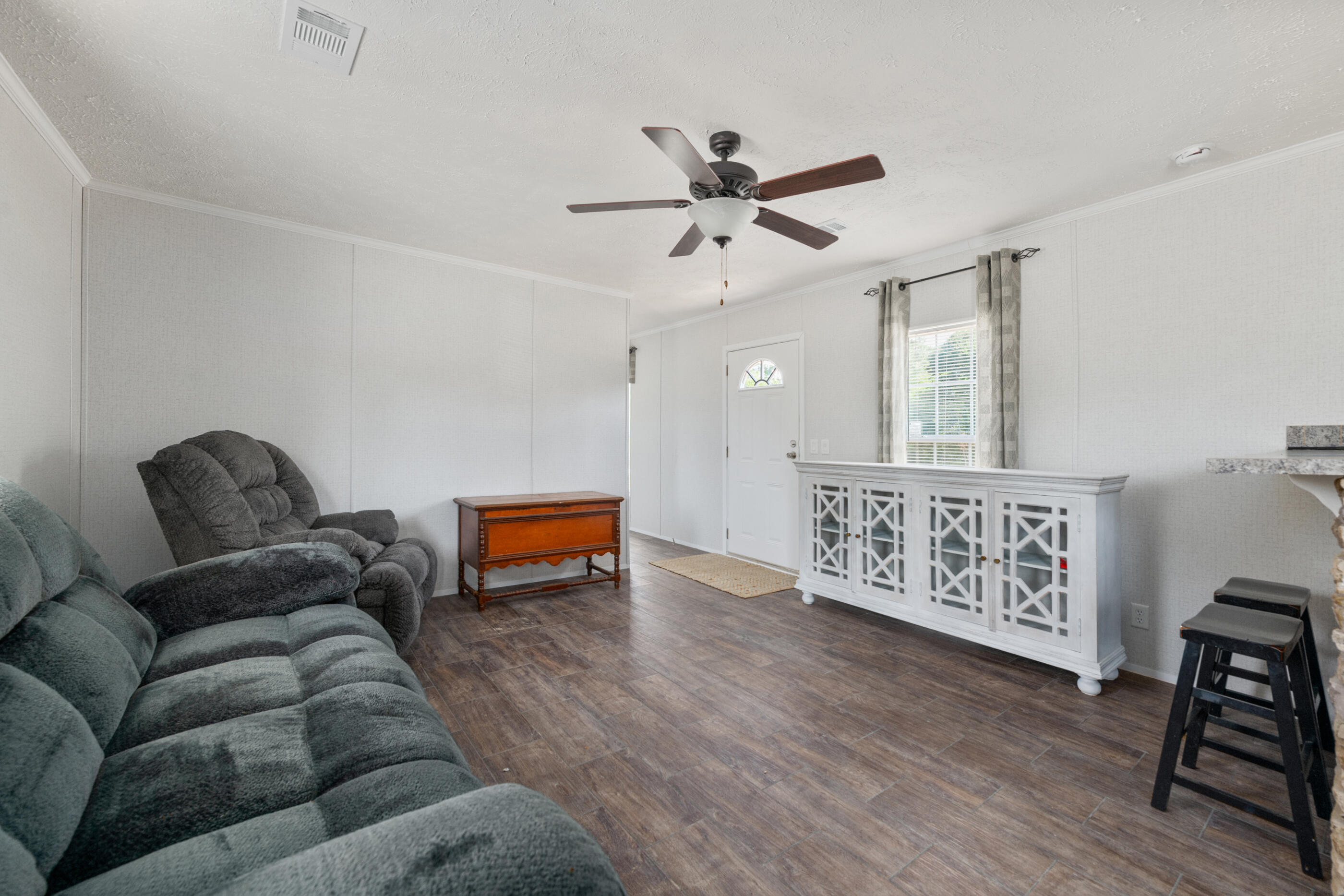 2791 Oakridge Road DeFuniak Springs, FL 32433 - Photo 8 of 10 a living room with furniture and a wooden floor