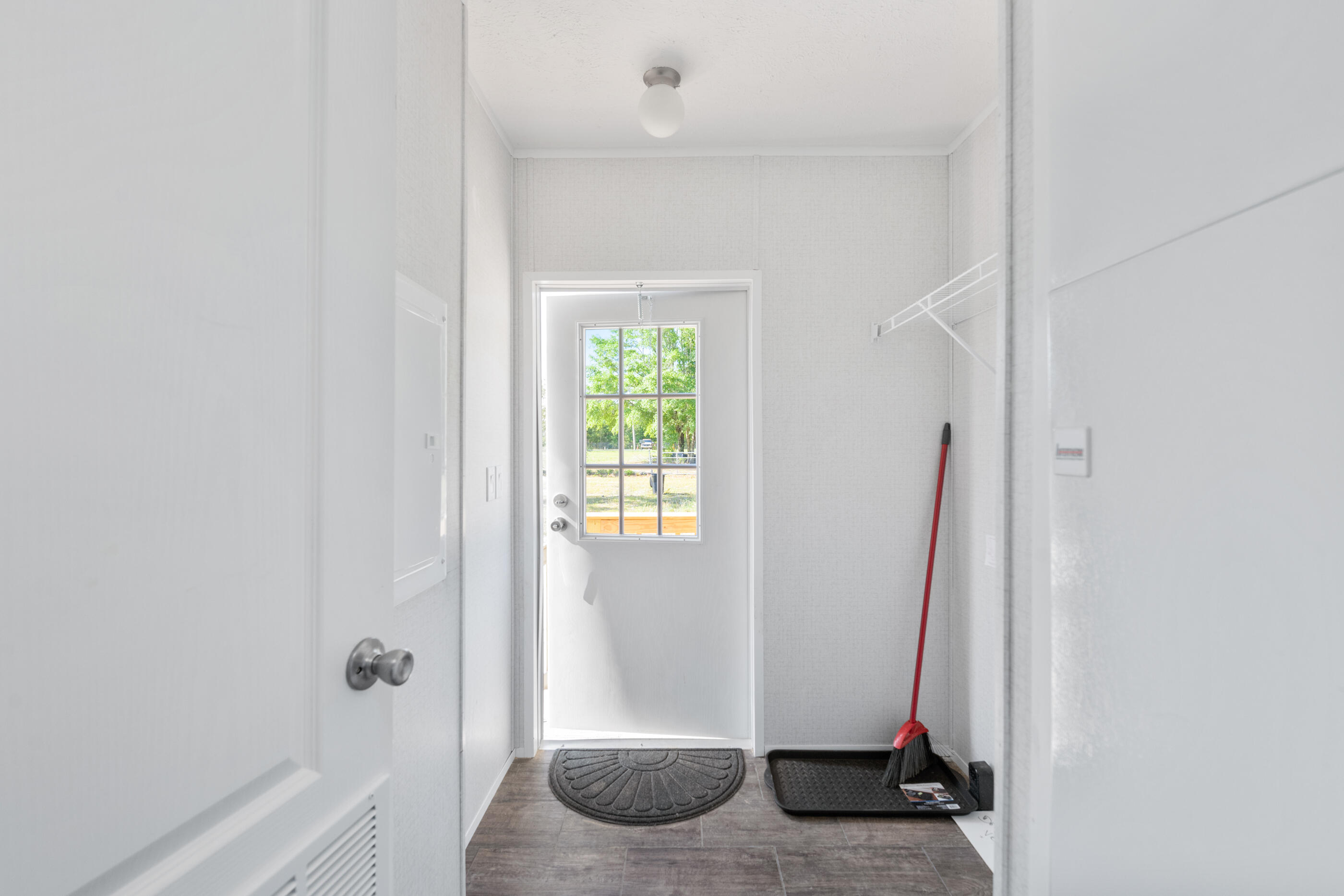 2791 Oakridge Road DeFuniak Springs, FL 32433 - Photo 10 of 10 a view of an empty room with wooden floor and a window