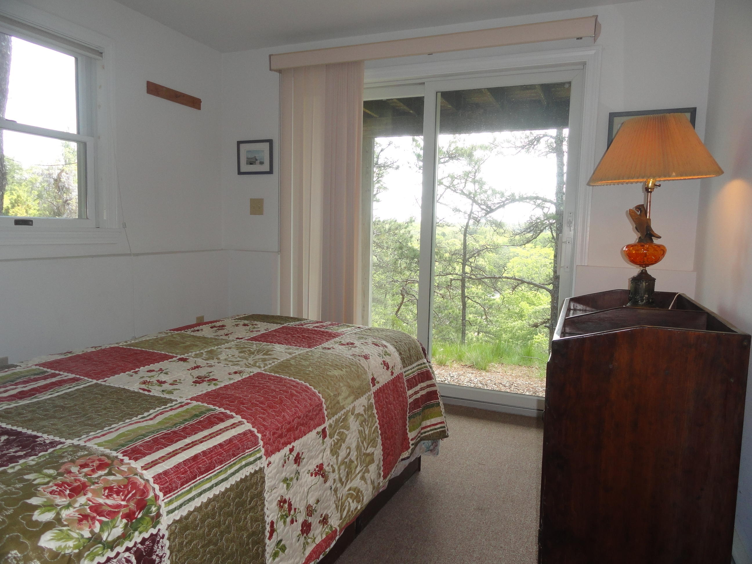 69 Bay View Road Wellfleet, MA 02667 - Photo 15 of 34 a bedroom with a bed and a window