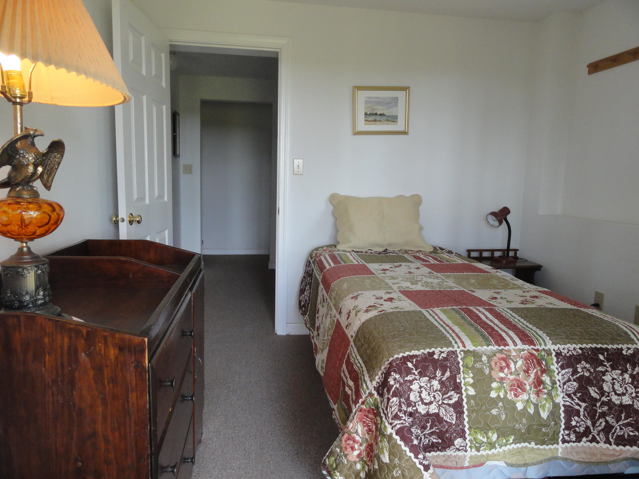 69 Bay View Road Wellfleet, MA 02667 - Photo 16 of 34 a bedroom with a bed and a window