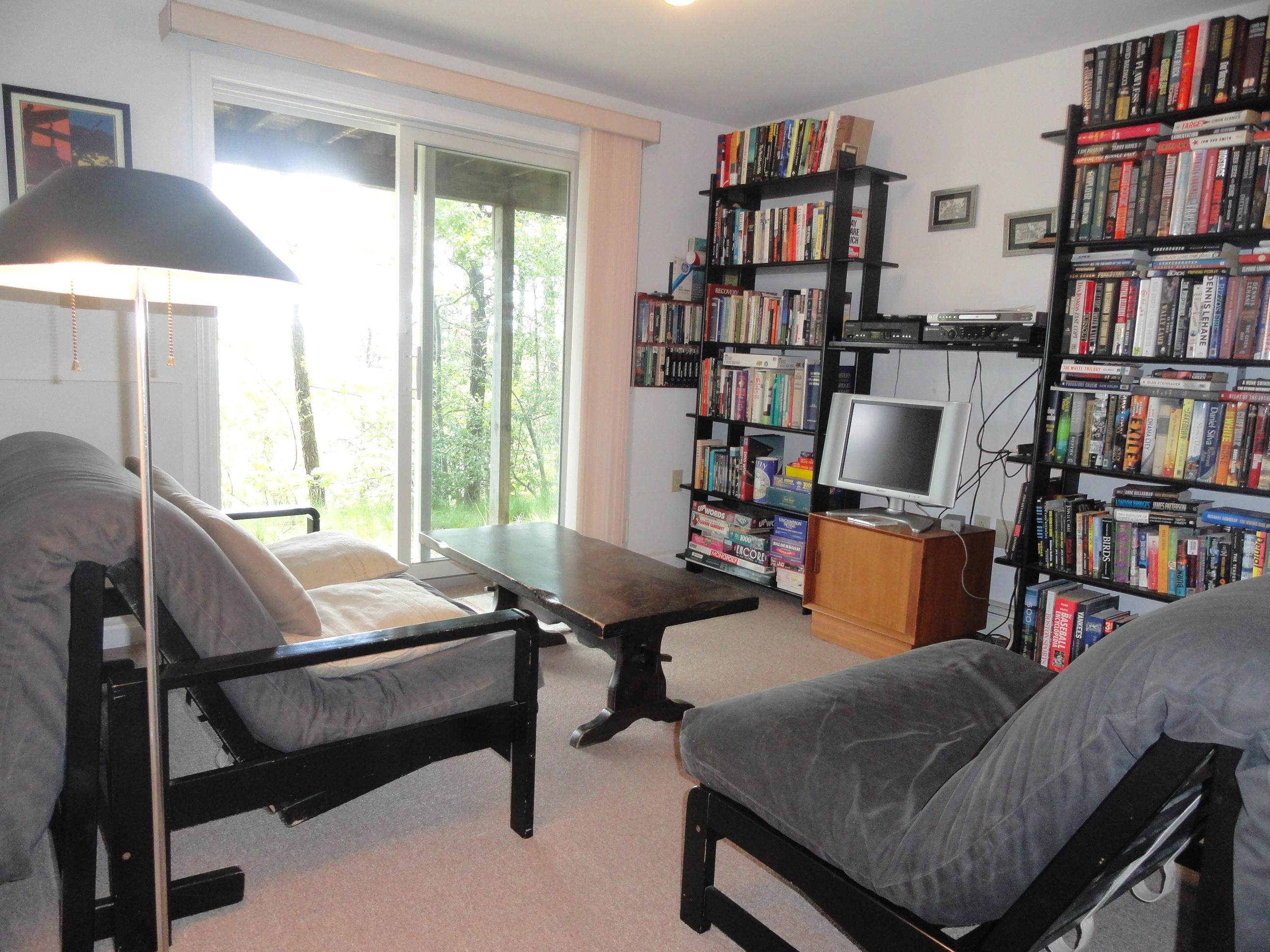 69 Bay View Road Wellfleet, MA 02667 - Photo 19 of 34 a reading room with furniture book shelf and a window