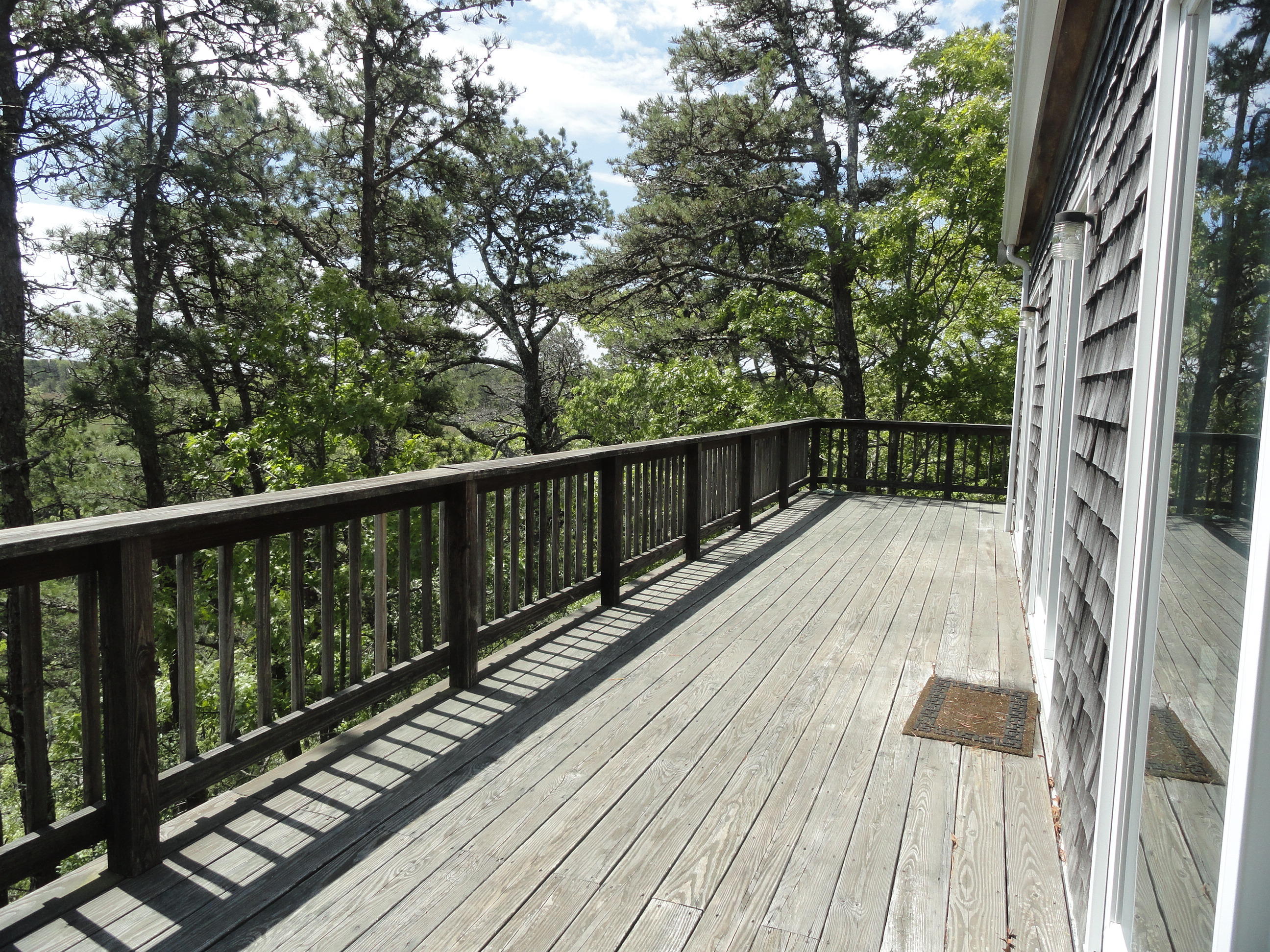 69 Bay View Road Wellfleet, MA 02667 - Photo 22 of 34 a view of balcony with wooden floor and fence
