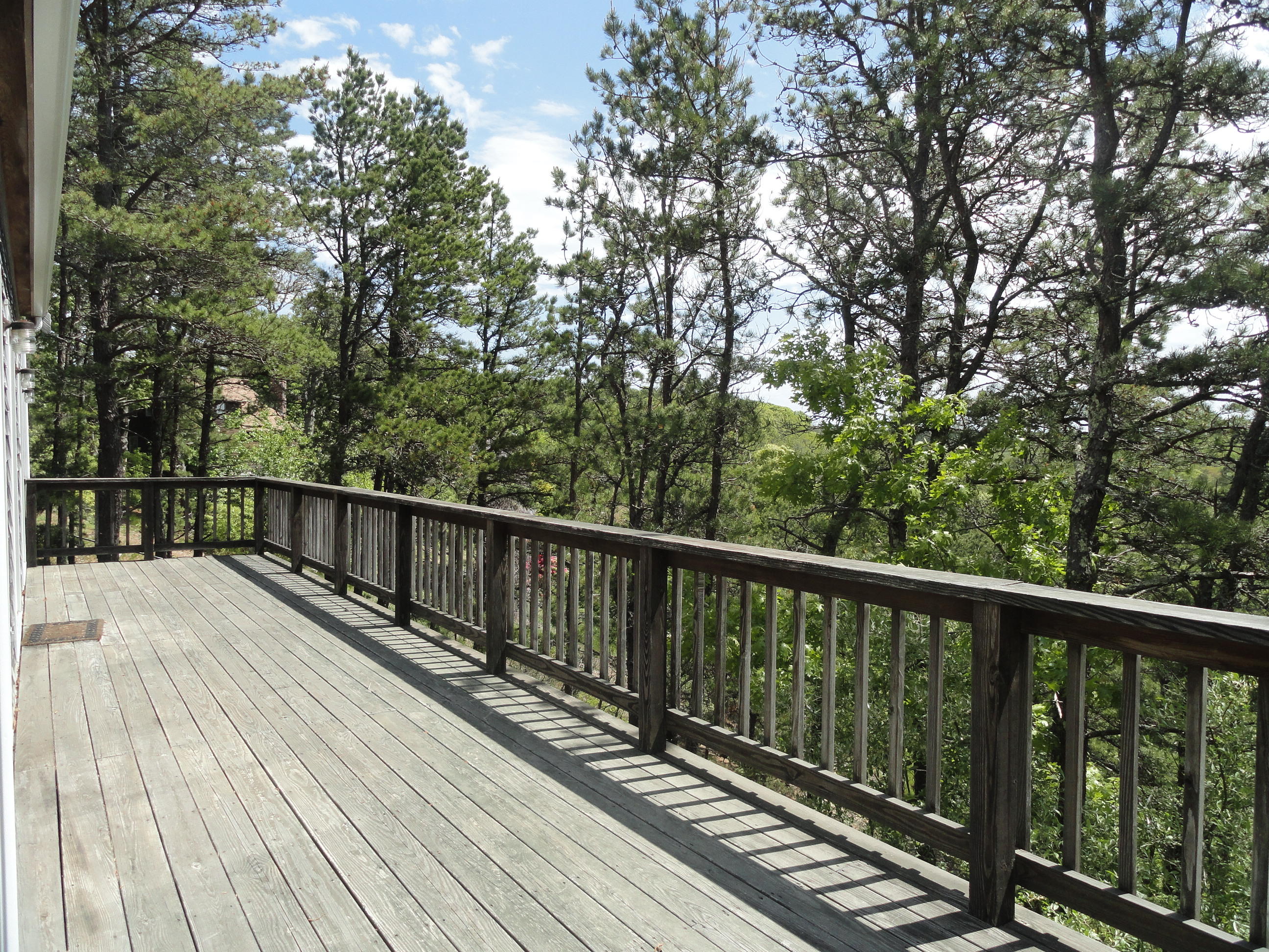 69 Bay View Road Wellfleet, MA 02667 - Photo 23 of 34 a view of balcony with wooden floor and fence