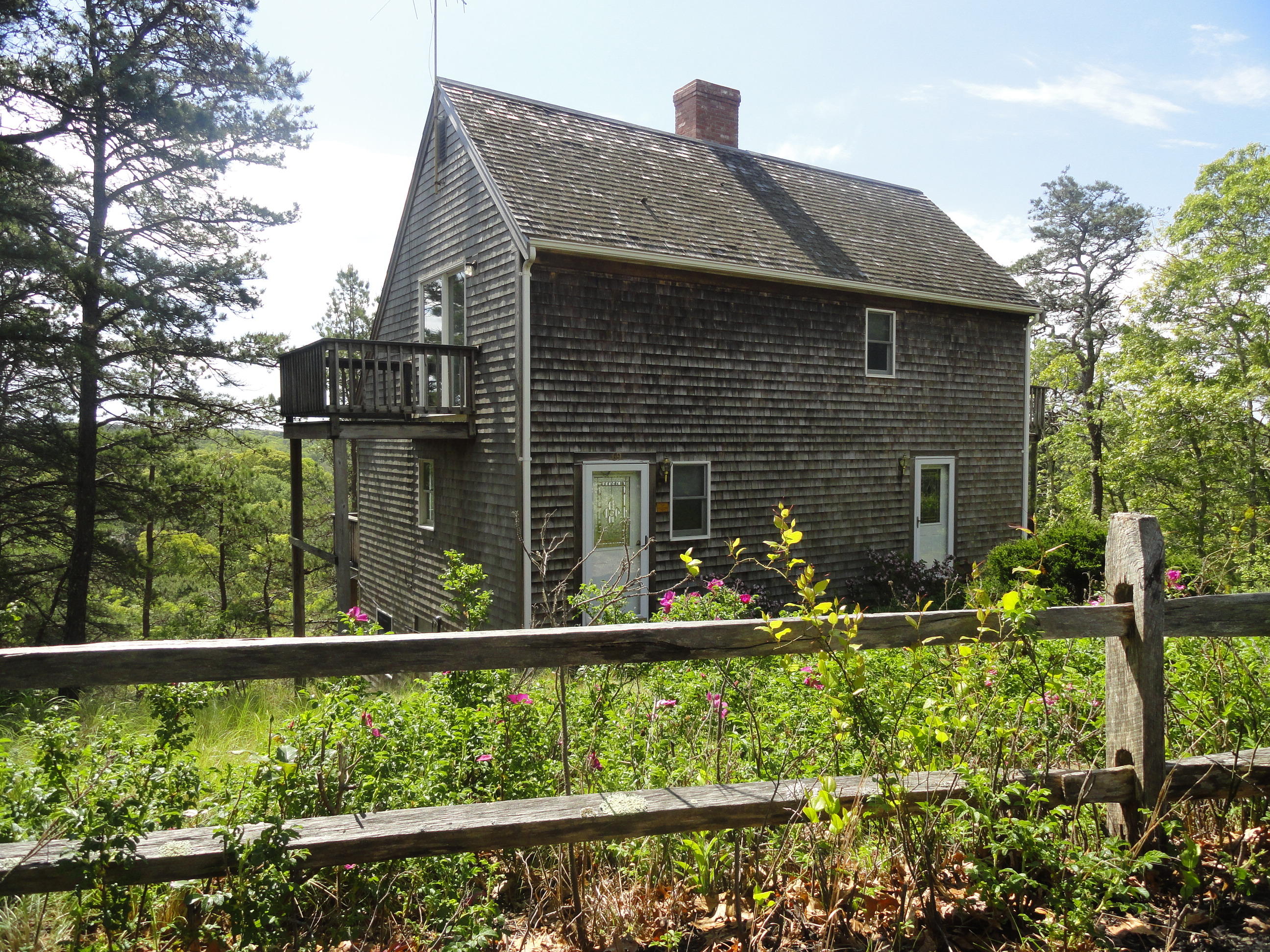 69 Bay View Road Wellfleet, MA 02667 - Photo 34 of 34 a front view of house with yard and outdoor seating