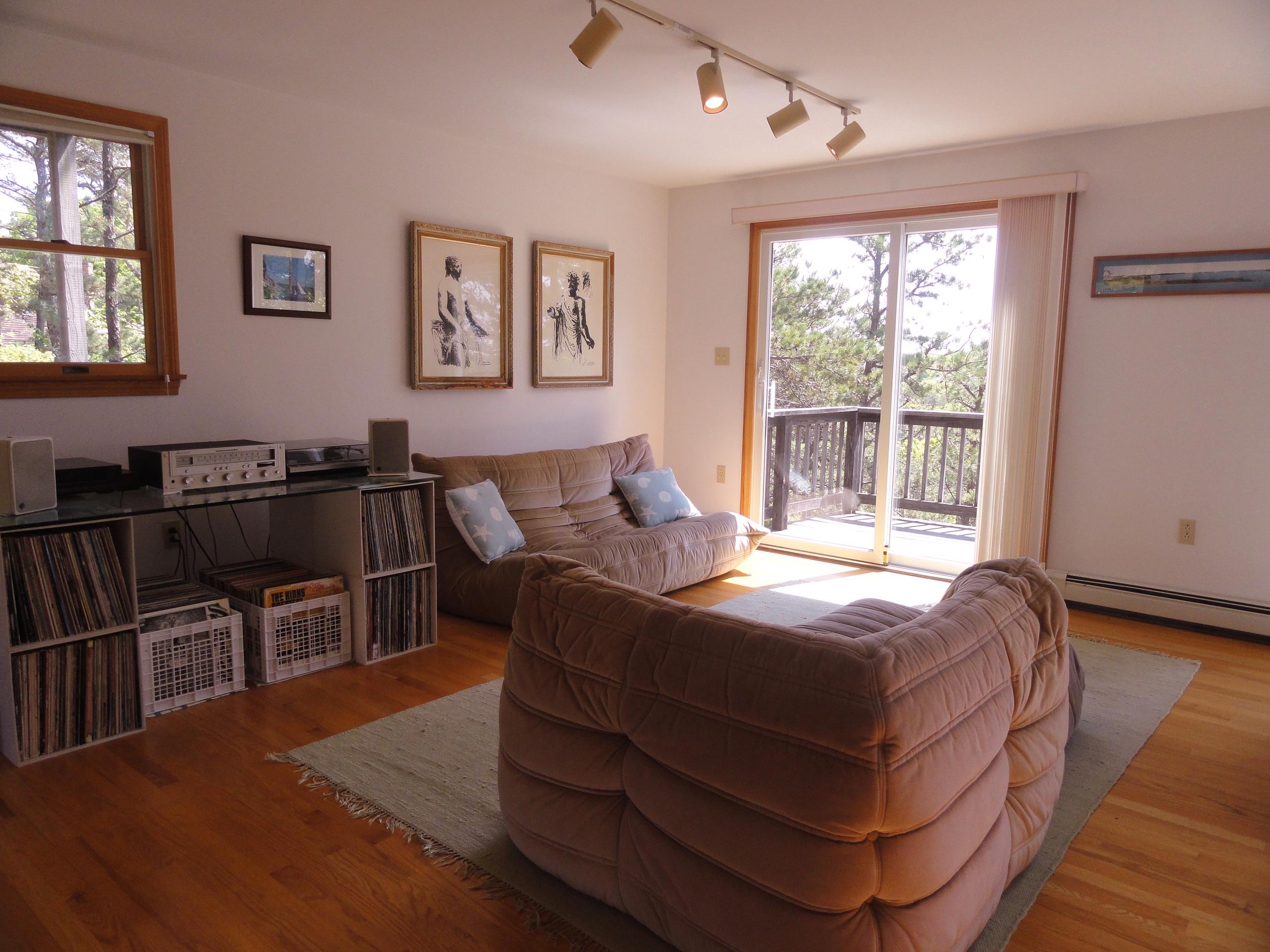 69 Bay View Road Wellfleet, MA 02667 - Photo 4 of 34 a bedroom with bed table and window