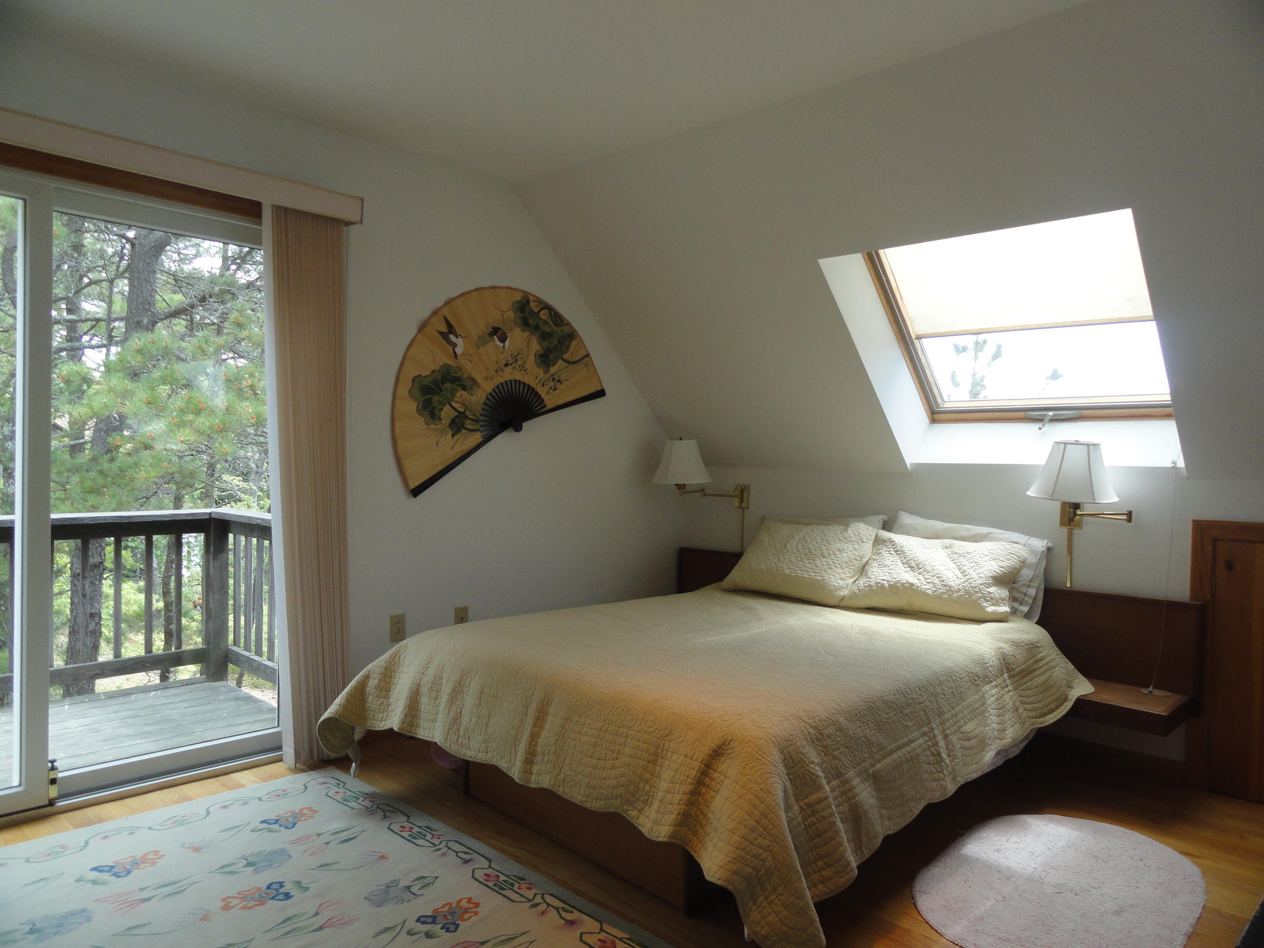 69 Bay View Road Wellfleet, MA 02667 - Photo 10 of 34 a bedroom with a bed and a window