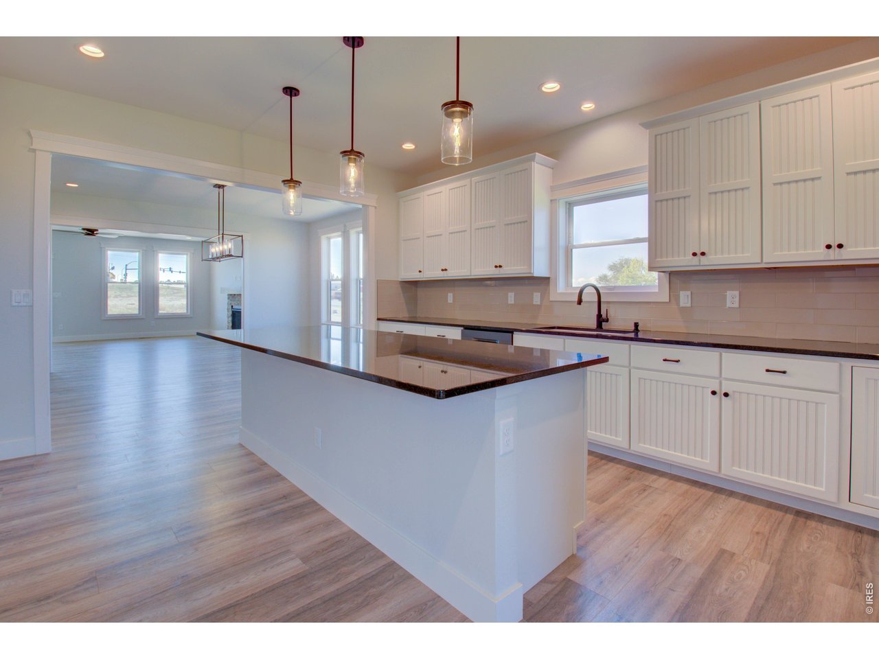5705 2nd Road Greeley, CO 80634 - Photo 17 of 46 Black chrome Samsung kitchen appliances, including a gas range/oven, are included
