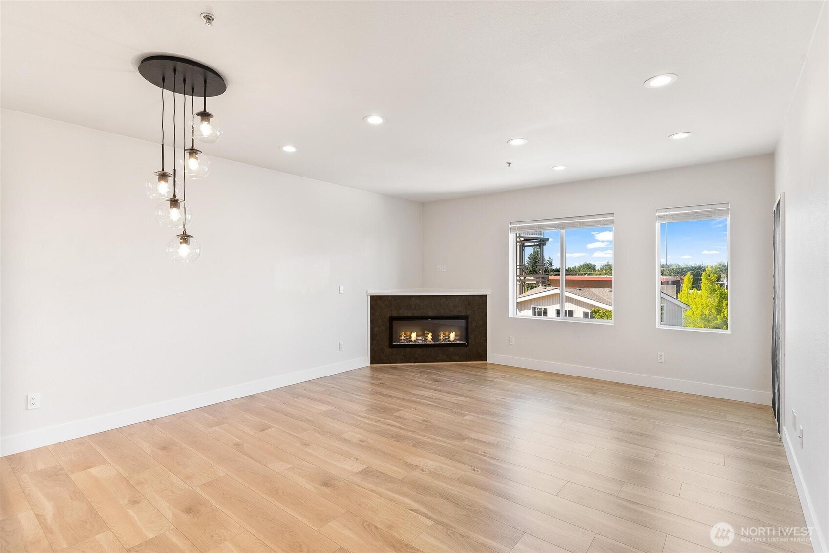 14915 38th Drive Southeast, Unit F3011 Bothell, WA 98012 - Photo 9 of 40 a view of an empty room with a window and fire place