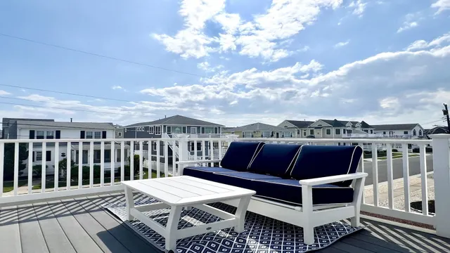 a view of entryway with wooden floor and stairs