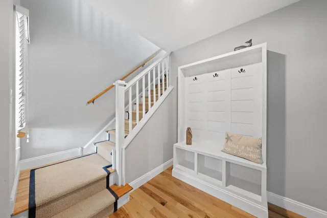 a bedroom with furniture and a rug