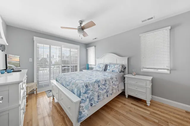 a bedroom with a bed and a television