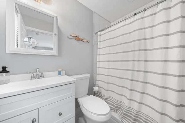 a bedroom with furniture and flat screen tv