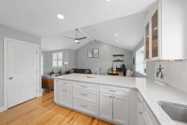 a kitchen with a sink and cabinets