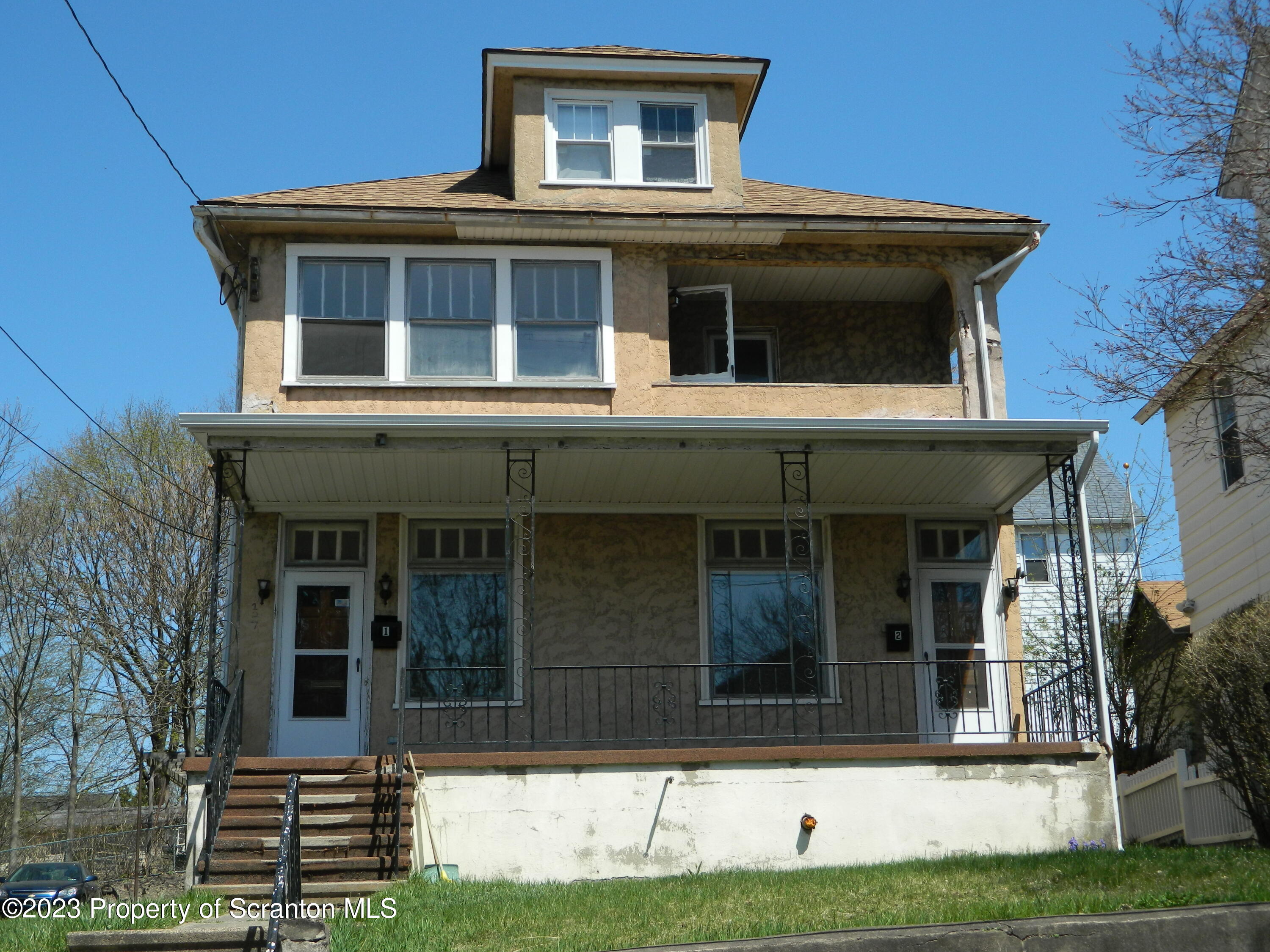 127 East Pine Street Dunmore, PA 18512 - Photo 1 of 20 a house view with a garden space