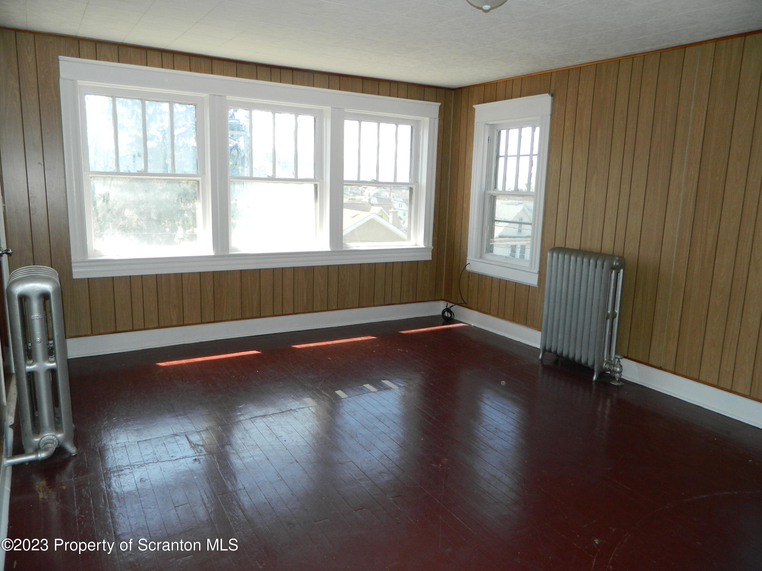 127 East Pine Street Dunmore, PA 18512 - Photo 11 of 20 a view of room with window and wooden floor
