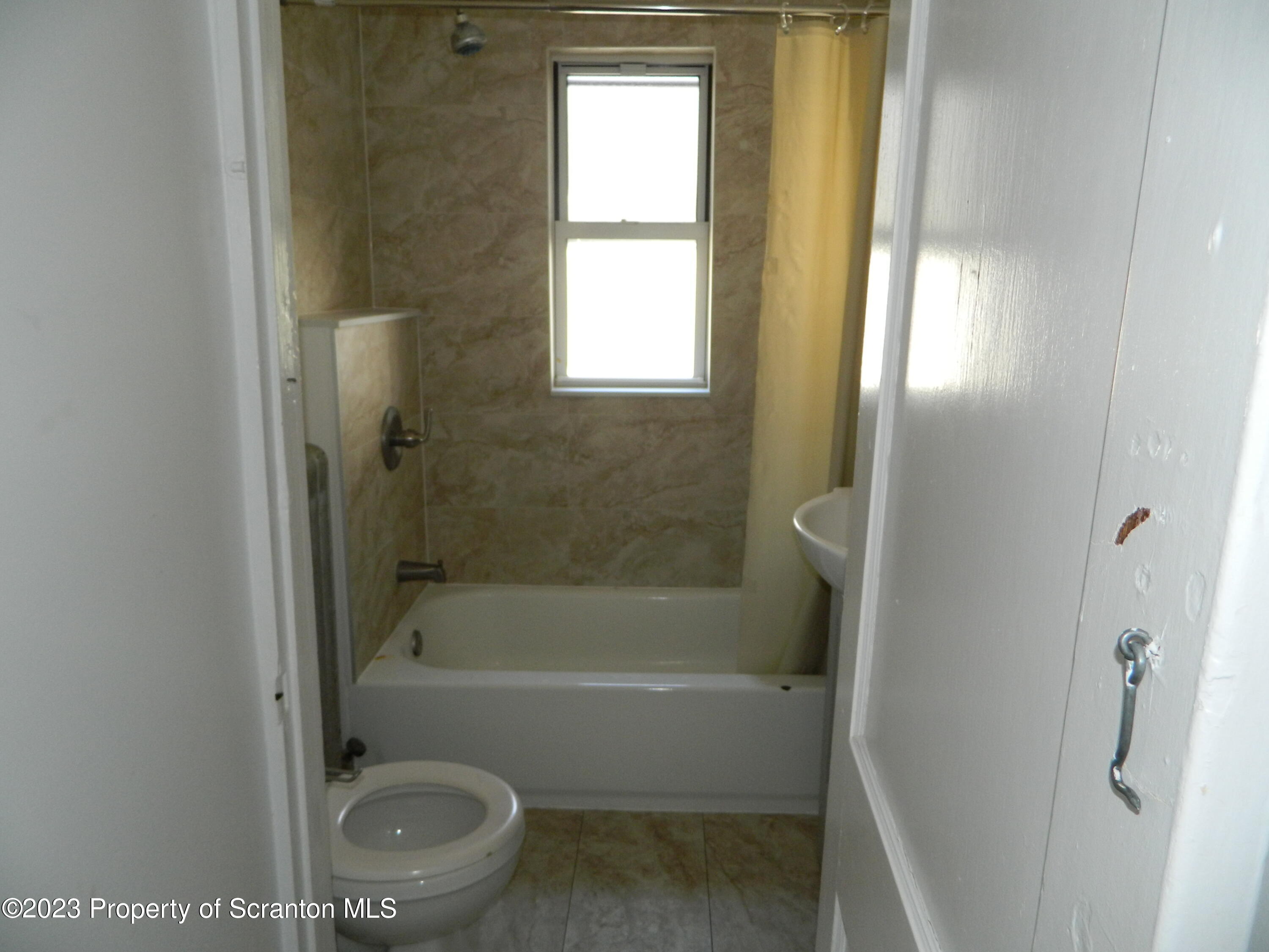 127 East Pine Street Dunmore, PA 18512 - Photo 19 of 20 a bath room with a bath tub and a shower