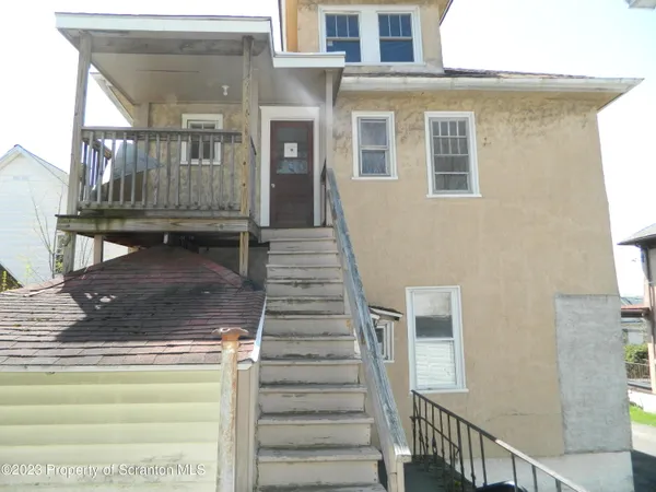 a view of house with deck