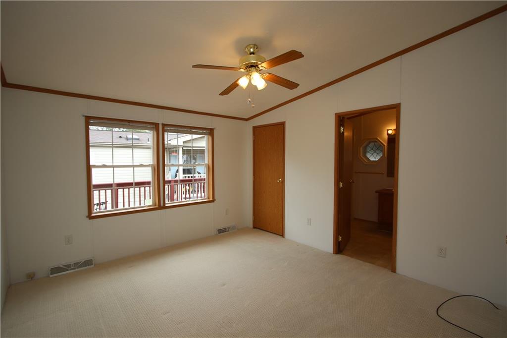 115 Eagle Pointe Estates New Eagle, PA 15067 - Photo 17 of 25 an empty room with ceiling fan and window
