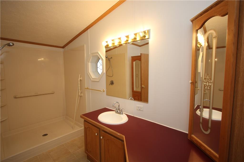 115 Eagle Pointe Estates New Eagle, PA 15067 - Photo 18 of 25 a bathroom with a sink and a mirror