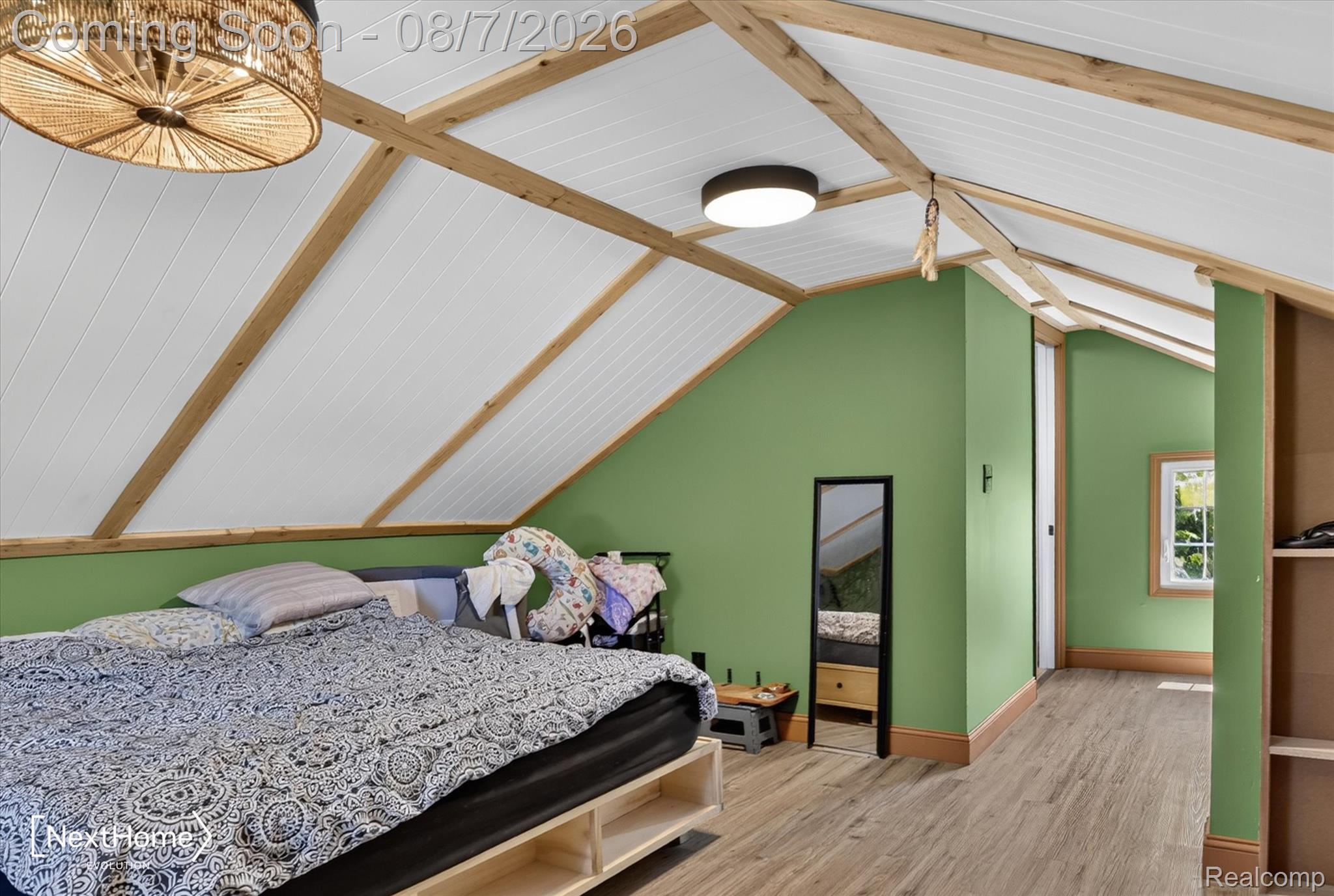 23740 Carleton West Road Belleville, MI 48111 - Photo 29 of 58 Sloping white paneled ceilings with exposed wood beams