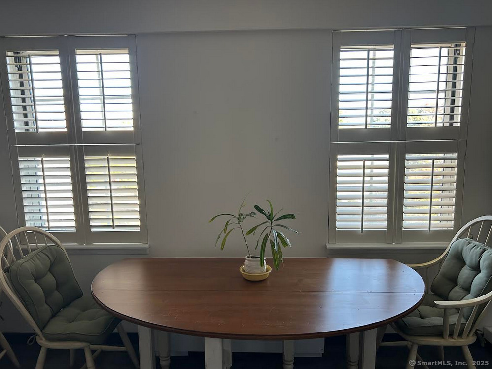 59 Courtland Avenue, Unit 3K Stamford, CT 06902 - Photo 19 of 31 a view of a dining room with furniture and window