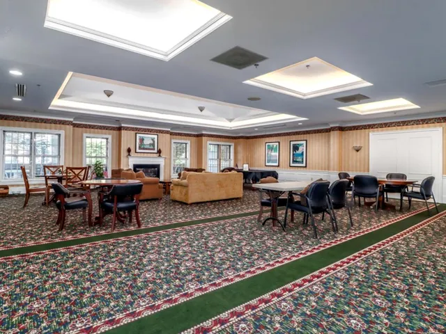 a living room with lots of furniture wooden floor and rug