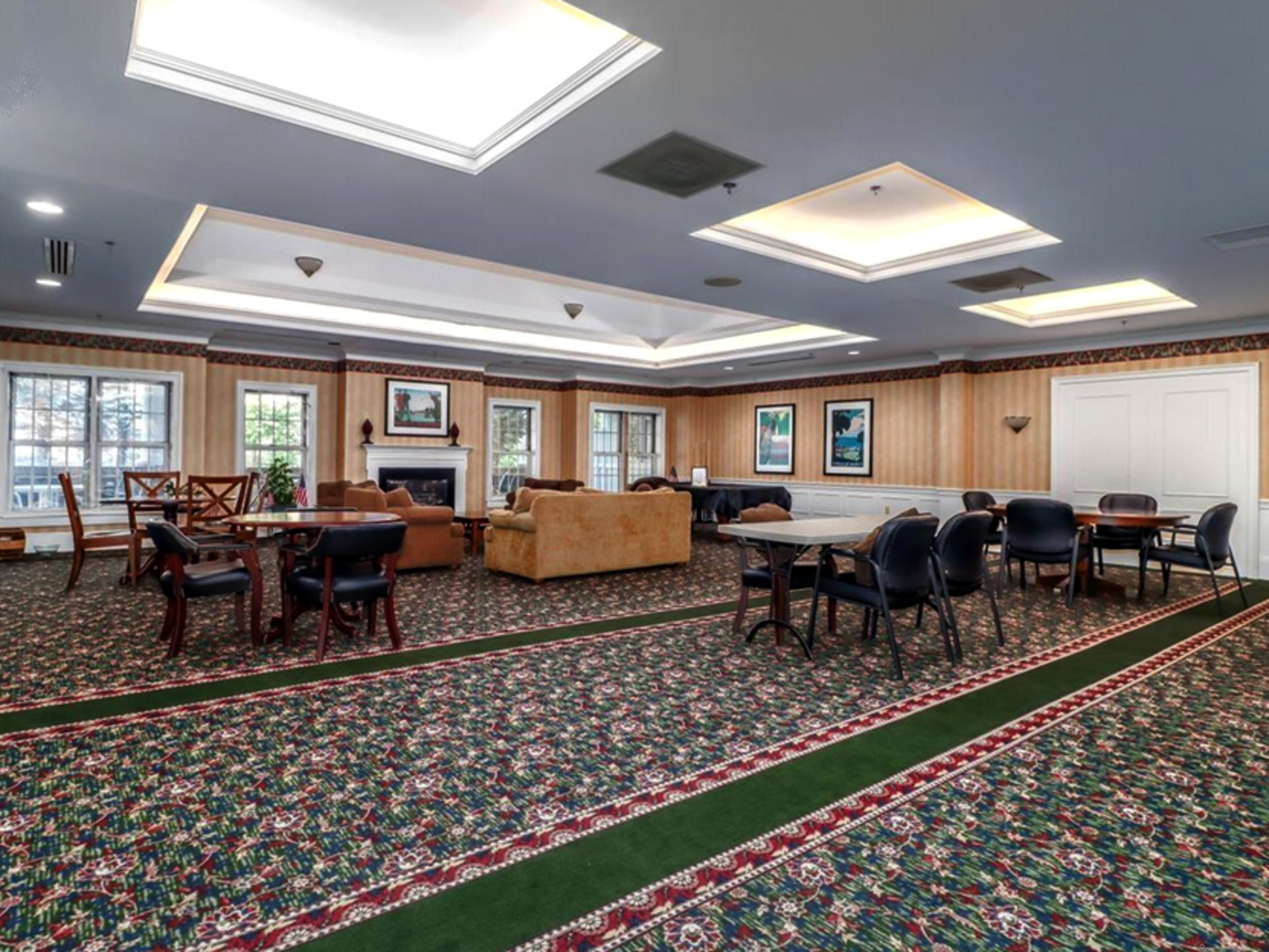 59 Courtland Avenue, Unit 3K Stamford, CT 06902 - Photo 23 of 31 a living room with lots of furniture wooden floor and rug