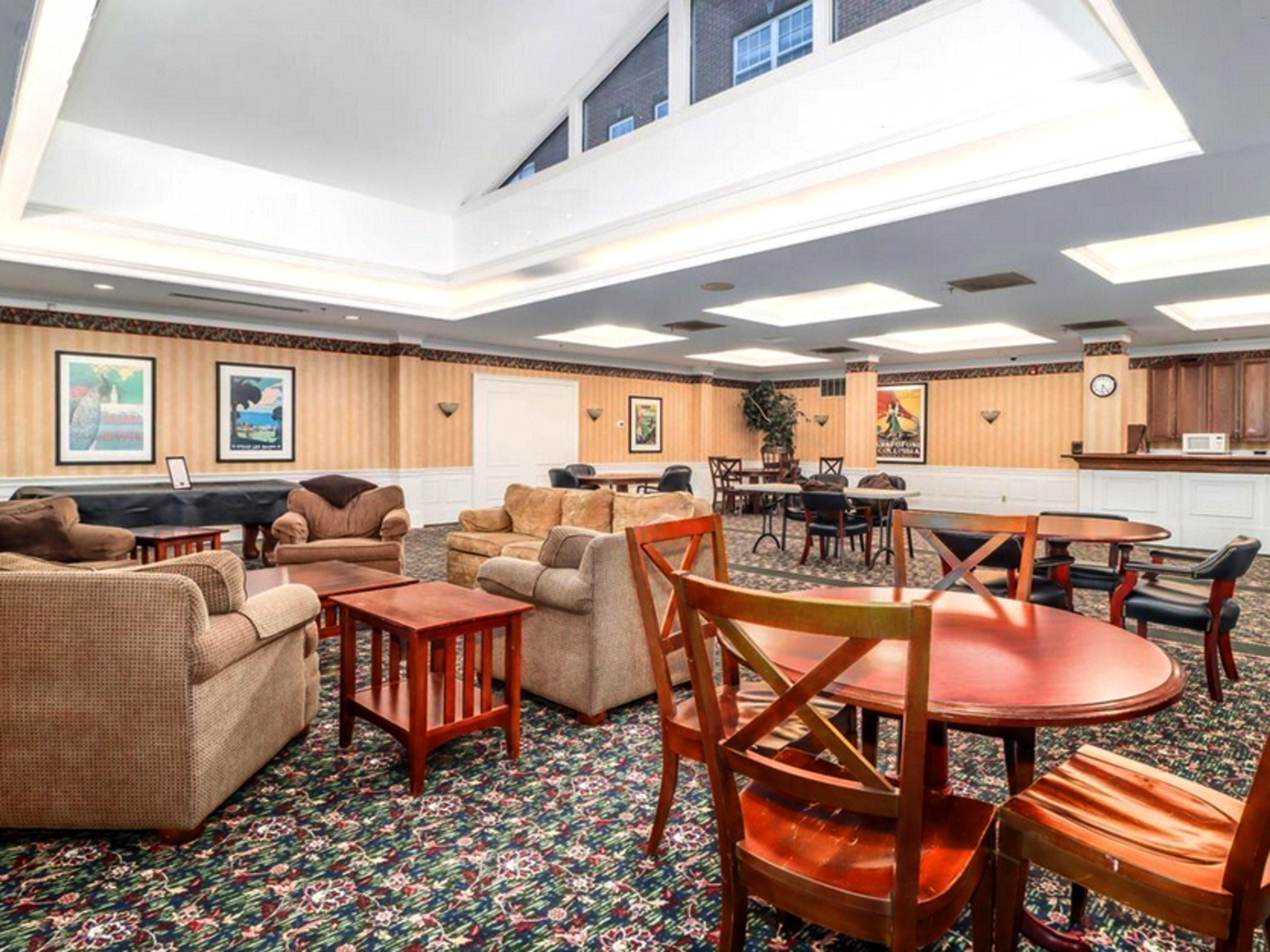 59 Courtland Avenue, Unit 3K Stamford, CT 06902 - Photo 7 of 31 a living room with lots of furniture and a painting on the wall