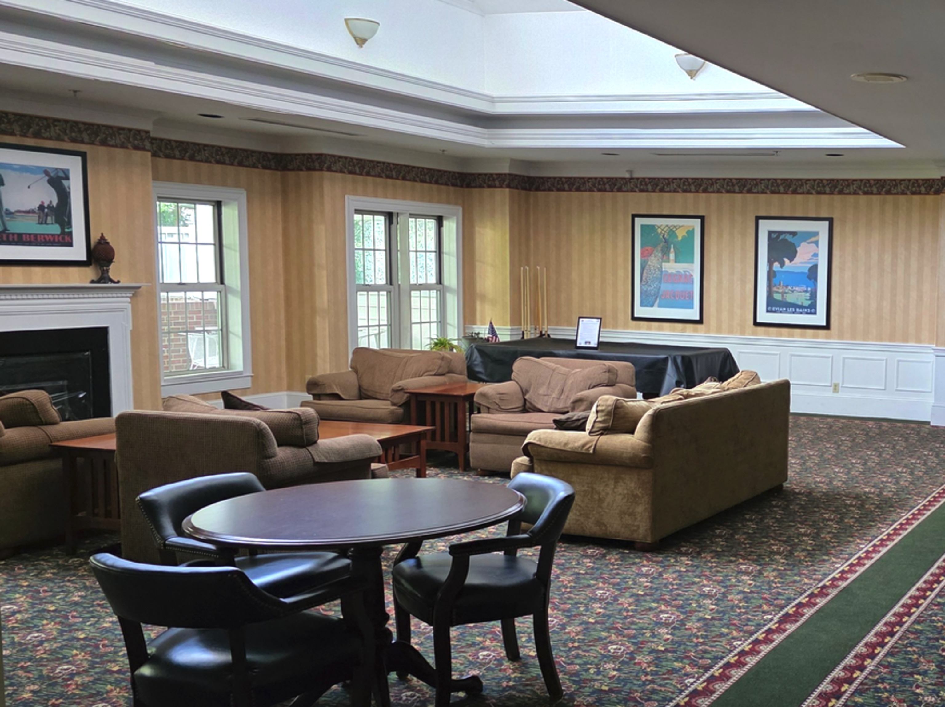 59 Courtland Avenue, Unit 3K Stamford, CT 06902 - Photo 9 of 31 a living room with furniture wooden floor and a fireplace