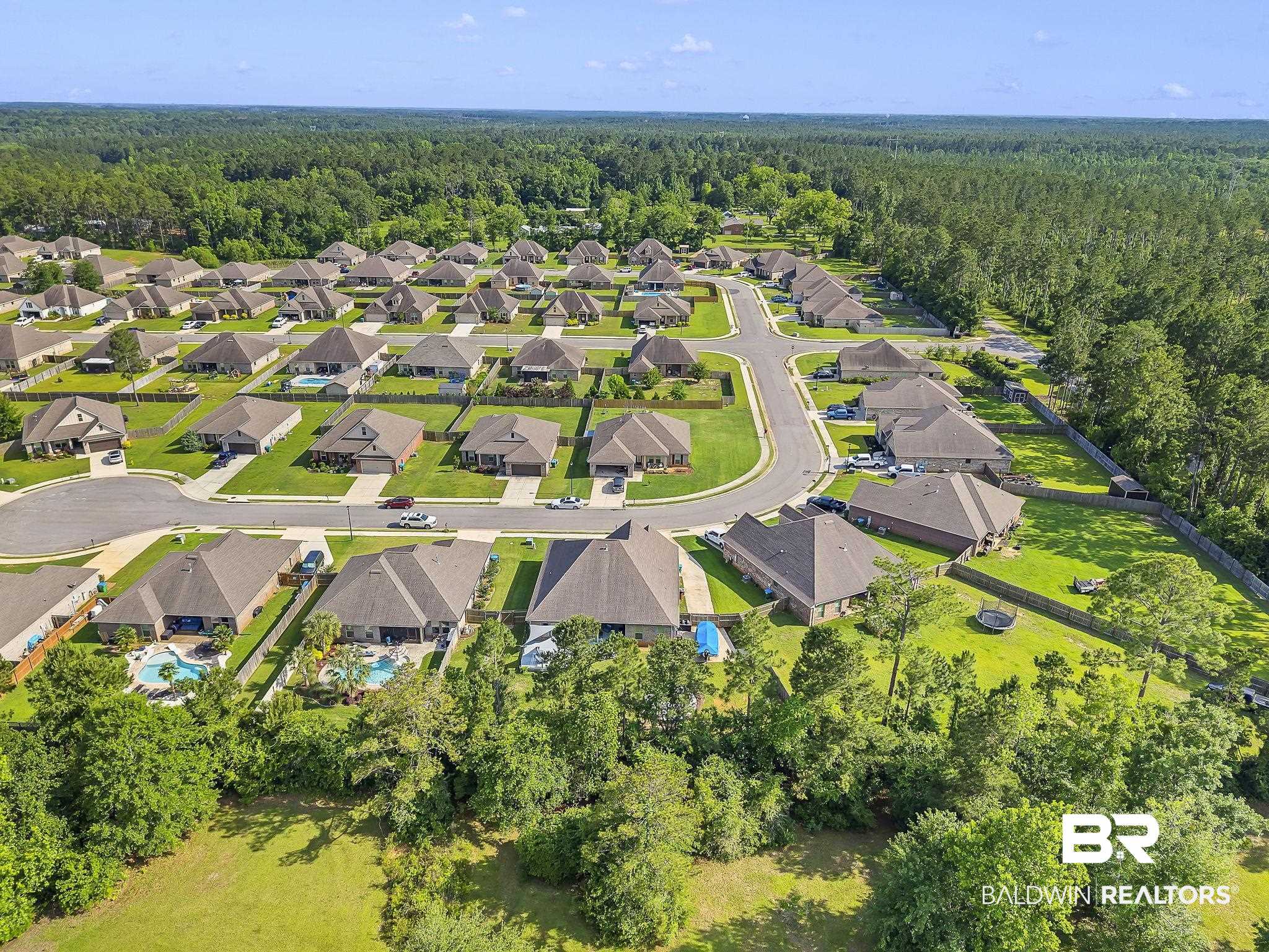 30635 Drayton Court Daphne, AL 36527 - Photo 49 of 51 Aerial view of property and surrounding area featuring a forest and nearby suburban area