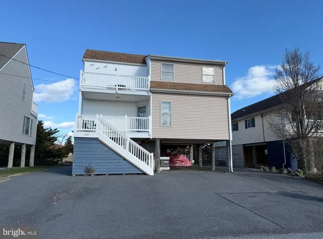 a view of a car park in front of house