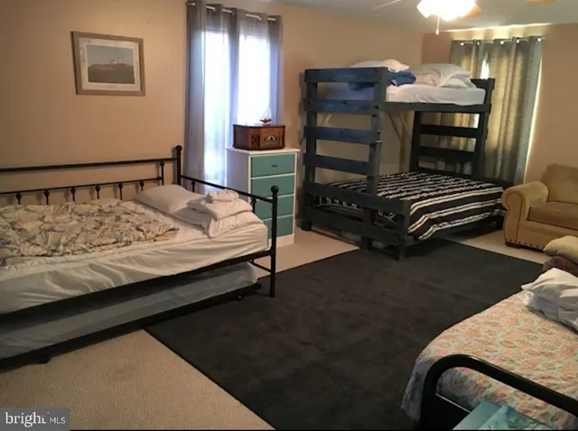 a bedroom with a bed and dresser