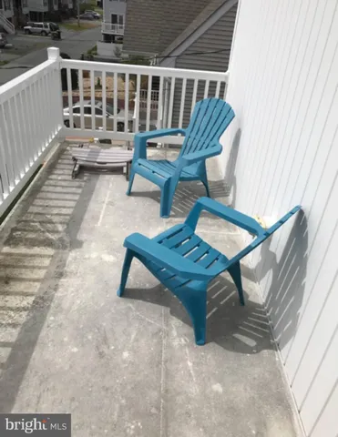 a view of balcony with wooden floor
