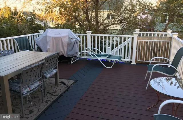 a view of a deck with furniture