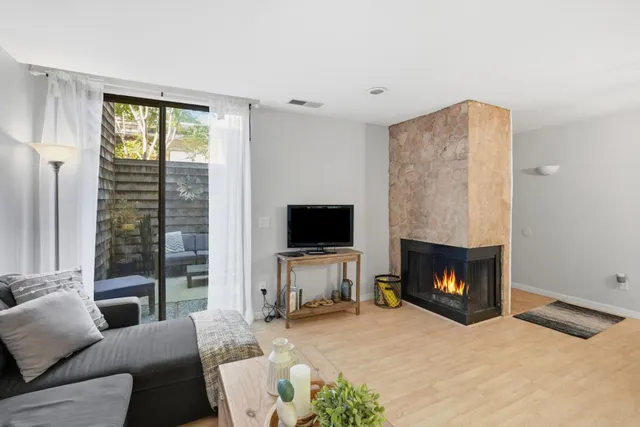 a kitchen with a refrigerator a stove and a sink