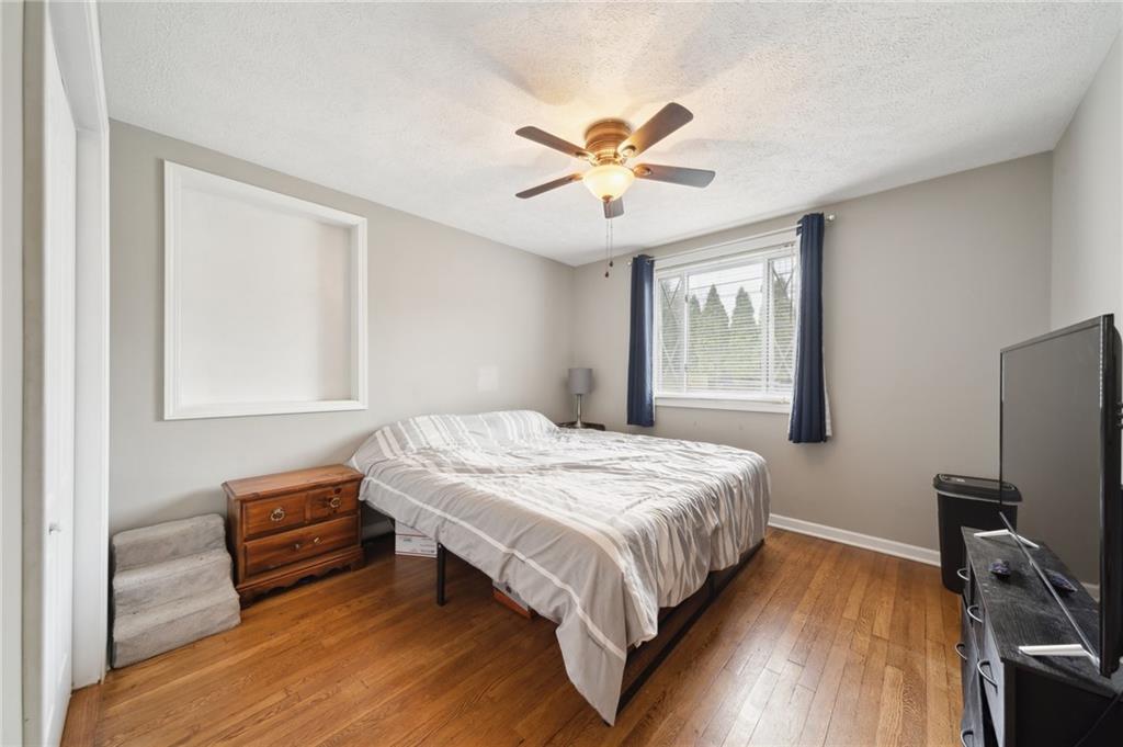431 Thompson Run Road Pittsburgh, PA 15237 - Photo 13 of 27 a bedroom with a bed and a window