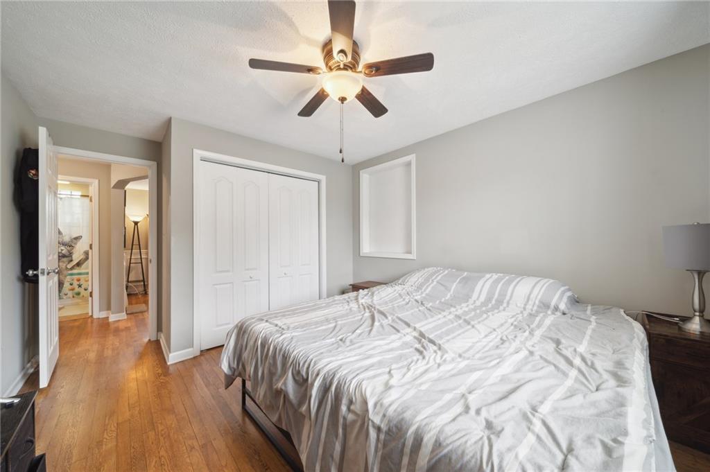 431 Thompson Run Road Pittsburgh, PA 15237 - Photo 14 of 27 a bedroom with a bed and a ceiling fan