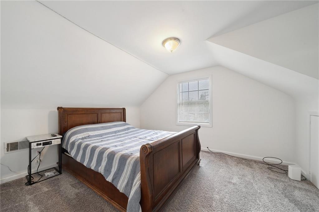 431 Thompson Run Road Pittsburgh, PA 15237 - Photo 16 of 27 a bedroom with a bed and a window