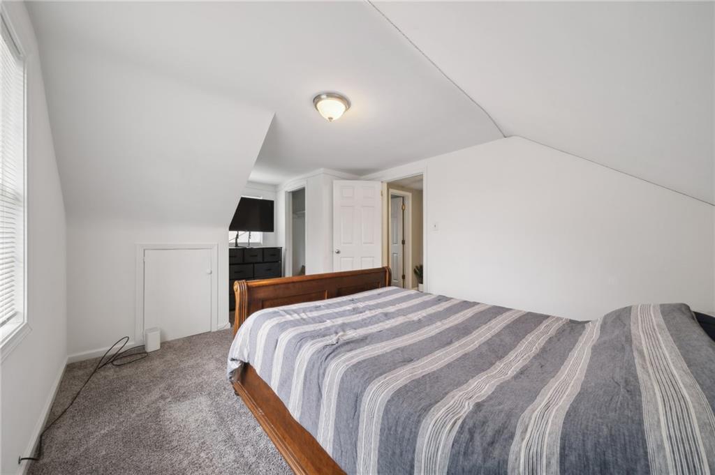 431 Thompson Run Road Pittsburgh, PA 15237 - Photo 17 of 27 a bedroom with a bed and a refrigerator