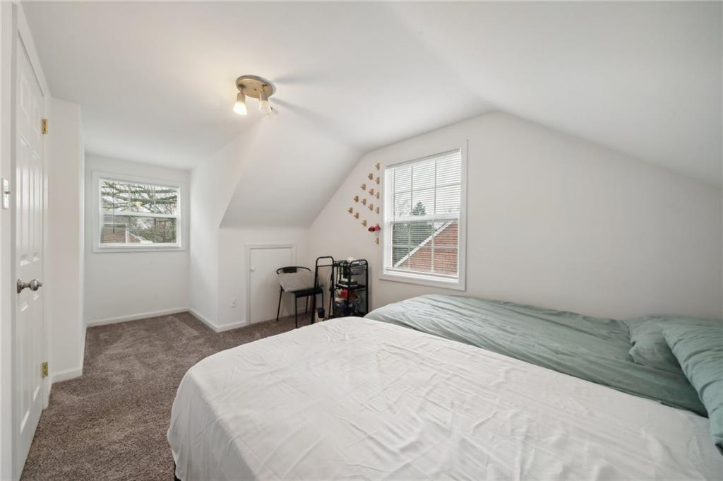 431 Thompson Run Road Pittsburgh, PA 15237 - Photo 19 of 27 a bedroom with a bed and a window