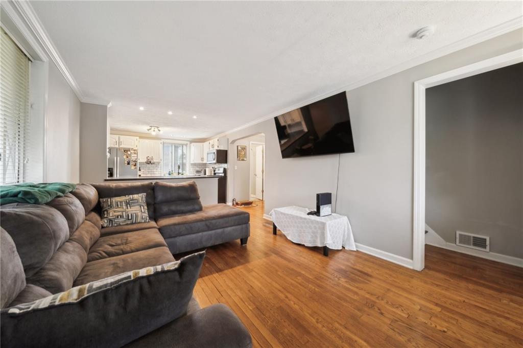 431 Thompson Run Road Pittsburgh, PA 15237 - Photo 3 of 27 a living room with furniture and a flat screen tv