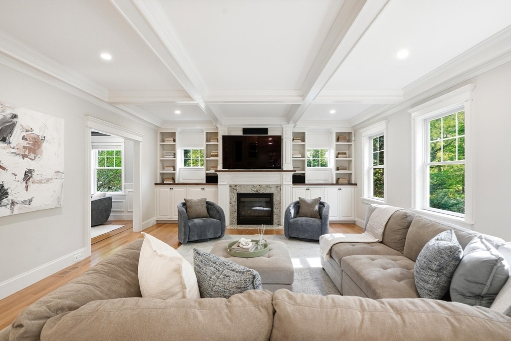 6 Flintlock Road Lexington, MA 02420 - Photo 2 of 39 a living room with furniture a large window and a fireplace