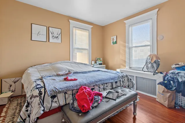 a bed room with a bed and a window