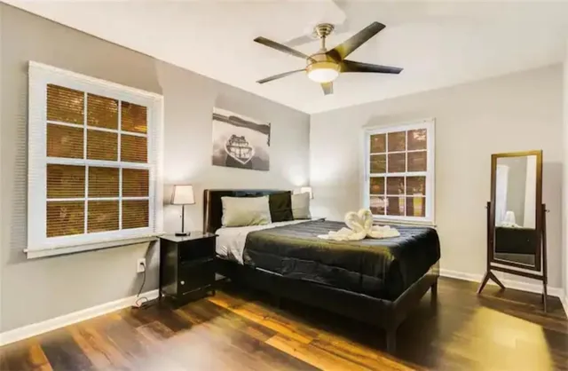 a bedroom with a bed and window