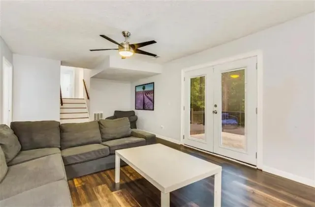 a view of a dining room with furniture wooden floor and chandelier