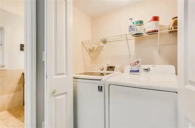 a view of a patio with table and chairs with wooden floor and fence