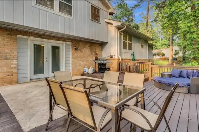 a view of a garden with tall trees