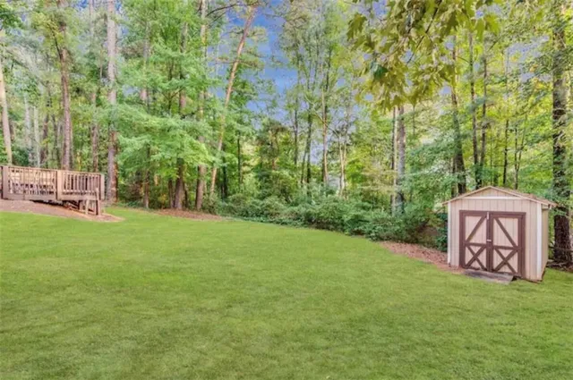 a view of a chair and tables in the garden