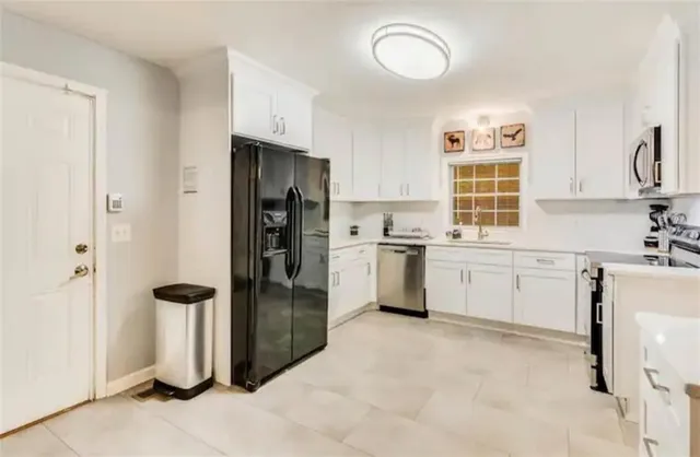 a bedroom with a bed and a night stand