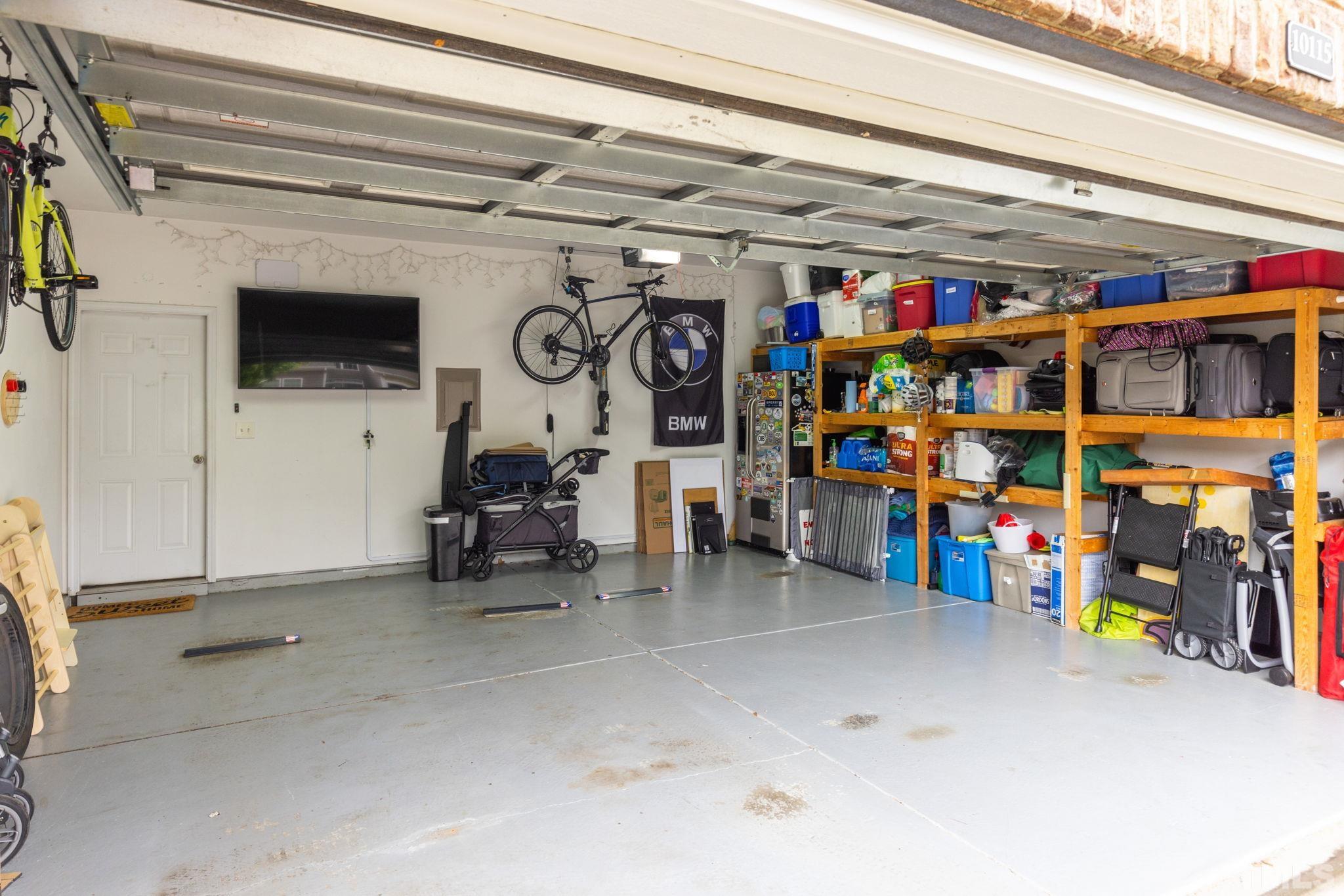 10115 Glen Autumn Road Raleigh, NC 27617 - Photo 41 of 55 Even the garage has already been painted! Floor has been epoxied! Storage shelves installed! TV ready!